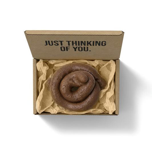 “Mystery Turd” prank gag gift box with fake poop and humorous message “Just Thinking of You” printed on inside packaging
